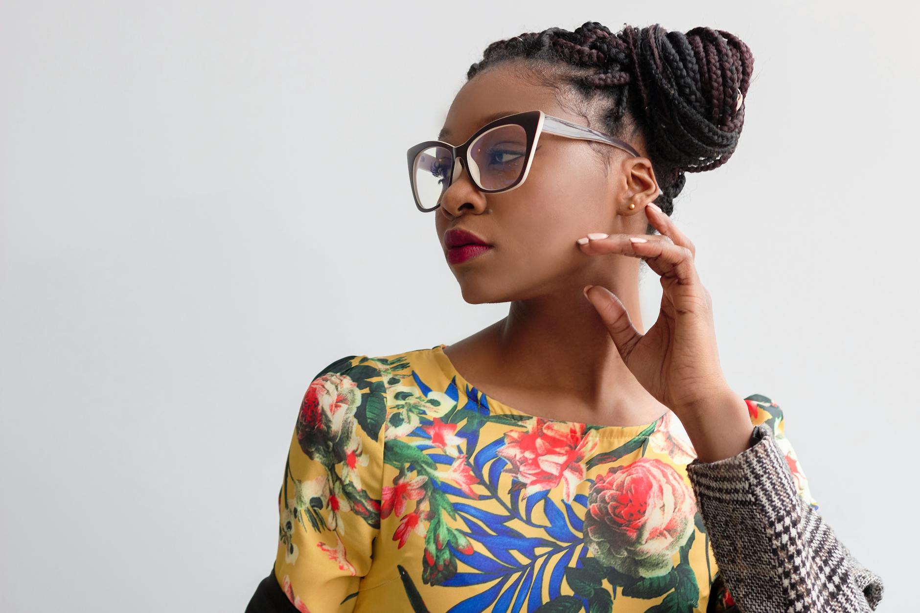 photo of woman wearing yellow floral top